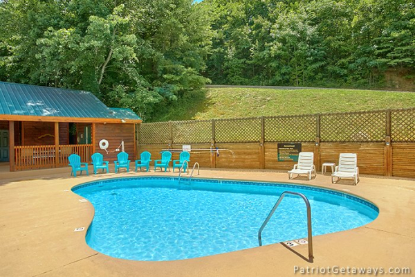 Guests at Howlin' in the Smokies, a 2 bedroom cabin rental located in Pigeon Forge have access to the pool at Starr Crest Resort
