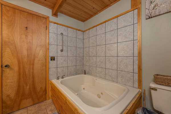 Jacuzzi tub in a bathroom at Snuggle Inn, a 2 bedroom cabin rental located in Pigeon Forge