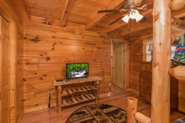 TV in the bunk room at Leconte View Lodge, a 3 bedroom cabin rental located in Pigeon Forge