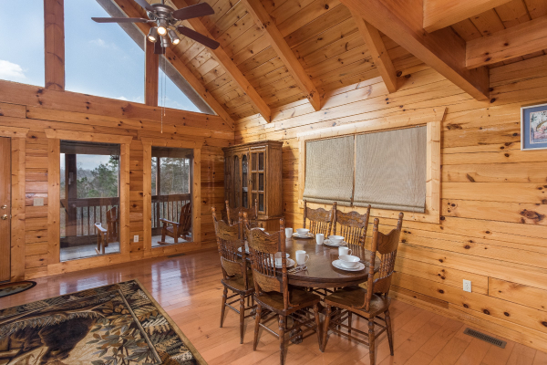 Dining table with seating for six at Leconte View Lodge, a 3 bedroom cabin rental located in Pigeon Forge