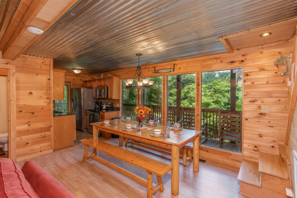 Dining table with bench seating for six at License to Chill, a 3 bedroom cabin rental located in Gatlinburg