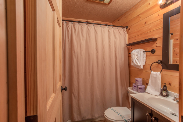 Bathroom with a tub and shower at License to Chill, a 3 bedroom cabin rental located in Gatlinburg