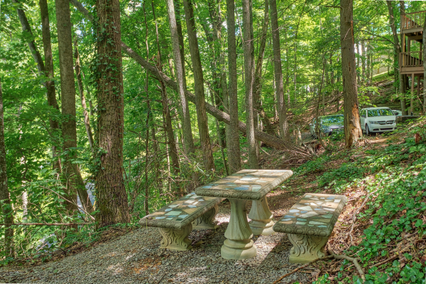 Concrete picnic table on the property at License to Chill, a 3 bedroom cabin rental located in Gatlinburg