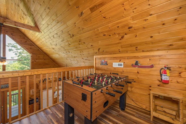 Foosball game at Eagle's Bluff, a 2 bedroom cabin rental located in Douglas lake