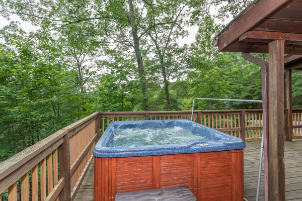Hot tub on the deck at Peace & Quiet, a 3 bedroom cabin rental located in Pigeon Forge