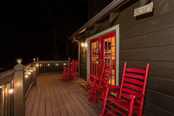 Back deck at night at Wonders in the Sky, a 3 bedroom cabin rental located in Gatlinburg