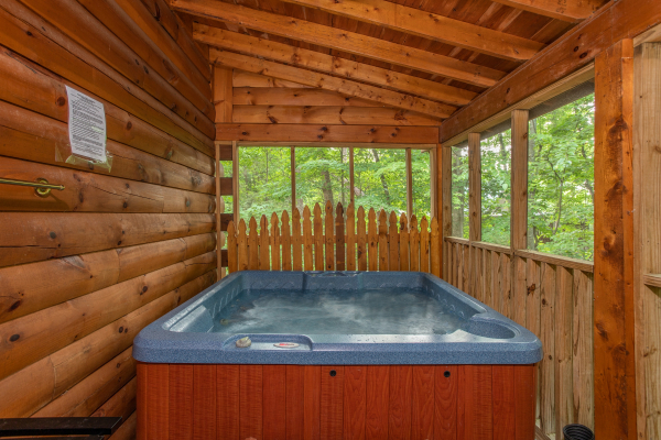 Hot tub on the covered porch at Lazy Mountain Retreat, a 1 bedroom cabin rental located in Gatlinburg