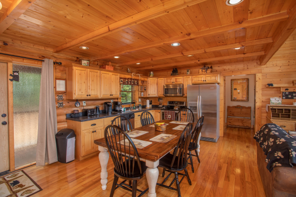 Dining space for six in the kitchen with stainless appliances at I Do Love Views, a 3 bedroom cabin rental located in Pigeon Forge
