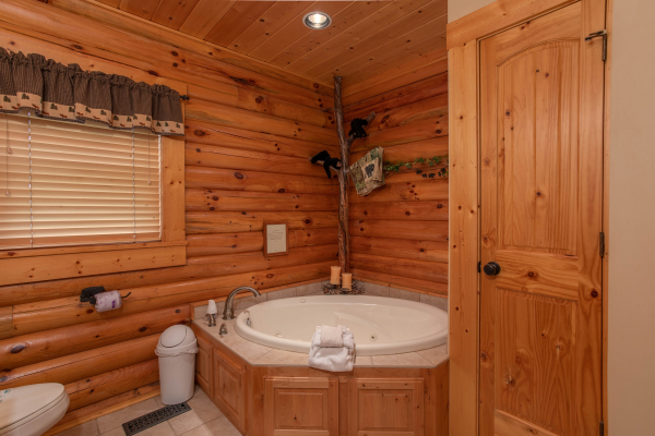 Jacuzzi in the corner of a bathroom at I Do Love Views, a 3 bedroom cabin rental located in Pigeon Forge