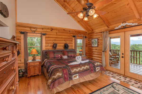King bedroom with deck access on the upper floor at I Do Love Views, a 3 bedroom cabin rental located in Pigeon Forge