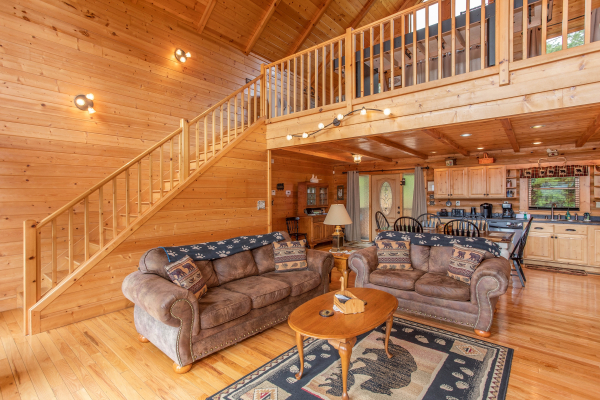 Living room with sofa and loveseat at I Do Love Views, a 3 bedroom cabin rental located in Pigeon Forge