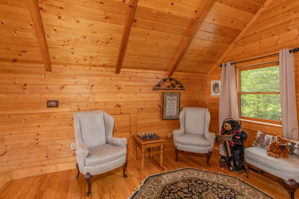 Sitting area with two plush chairs in the loft space at I Do Love Views, a 3 bedroom cabin rental located in Pigeon Forge