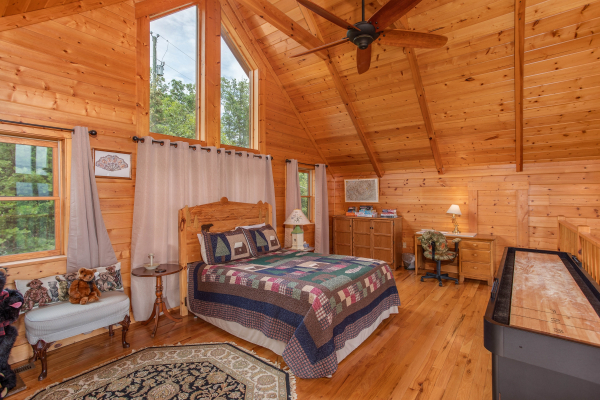 Bedroom in the vaulted loft space at I Do Love Views, a 3 bedroom cabin rental located in Pigeon Forge