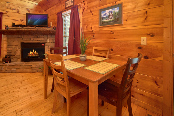 Dining table for four at Pop's Snuggle Bear, a 1 bedroom cabin rental located in Pigeon Forge