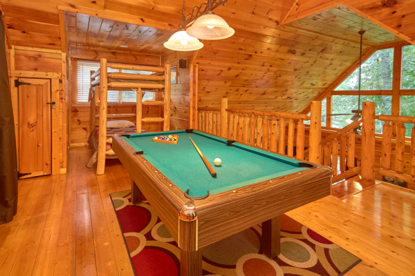 Pool table in the loft at Pop's Snuggle Bear, a 1 bedroom cabin rental located in Pigeon Forge