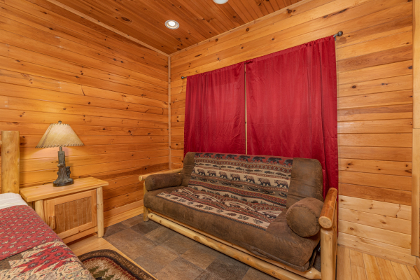 Futon in the lower bedroom at Cabin Life, a 2 bedroom cabin rental located in Pigeon Forge
