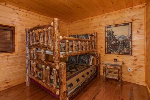 Log bunk bed at Four Seasons Palace, a 5-bedroom cabin rental located in Pigeon Forge