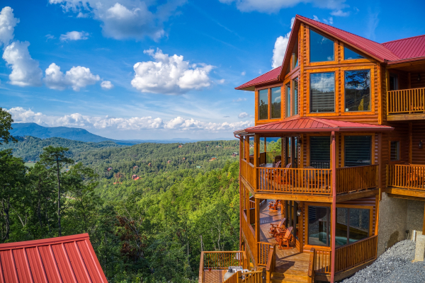 Cabin sitting in front of the mountains at Four Seasons Palace, a 5-bedroom cabin rental located in Pigeon Forge