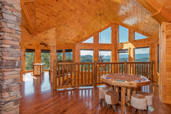 Game table in the loft at Four Seasons Palace, a 5-bedroom cabin rental located in Pigeon Forge