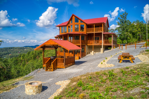 Picnic area and fire pit at Four Seasons Palace, a 5-bedroom cabin rental located in Pigeon Forge