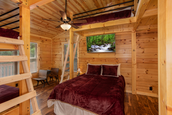 Bunk room with multiple beds at Paws on the Porch, a 2 bedroom cabin rental located in Gatlinburg
