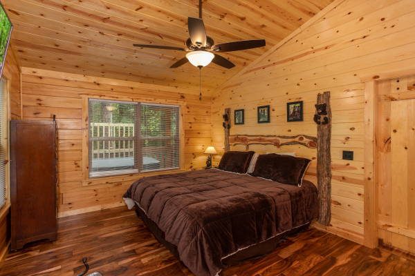Bedroom with king bed at Paws on the Porch, a 2 bedroom cabin rental located in Gatlinburg