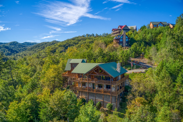 Looking at a cabin nestled in the hillside called Great View Lodge, a 5-bedroom cabin rental located in Pigeon Forge