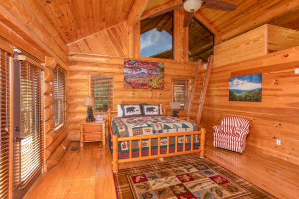 King bedroom with an additional sleeping loft at Great View Lodge, a 5-bedroom cabin rental located in Pigeon Forge