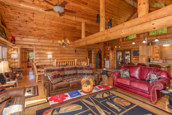Living room with lots of seating and a sleeper sofa at Great View Lodge, a 5-bedroom cabin rental located in Pigeon Forge
