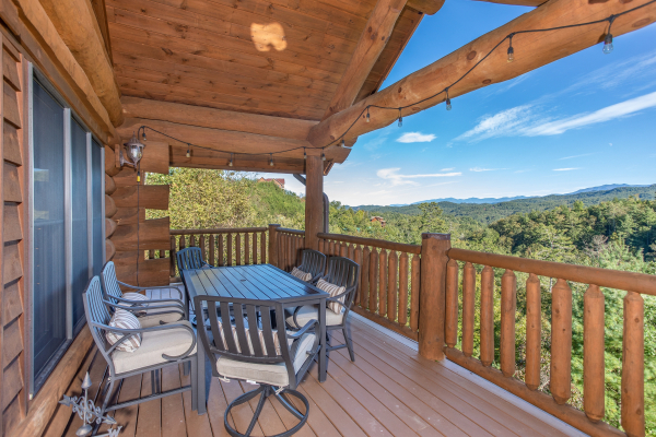 Mountain views from the dining space on the deck at Great View Lodge, a 5-bedroom cabin rental located in Pigeon Forge