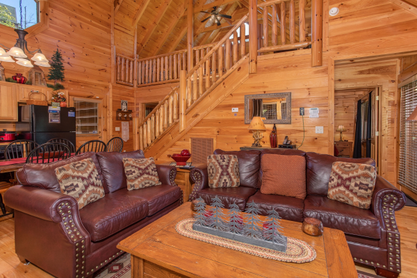 Living room couch and loveseat seating at Bears Eye View, a 2-bedroom cabin rental located in Pigeon Forge