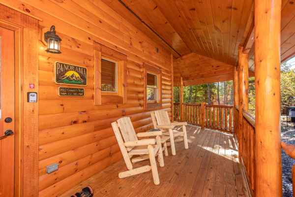 Front porch with two log chairs at Panorama, a 2 bedroom cabin rental located in Pigeon Forge