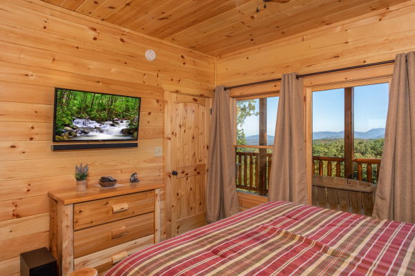 Dresser and TV in a bedroom at Panorama, a 2 bedroom cabin rental located in Pigeon Forge