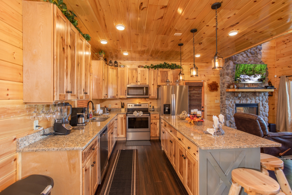 Kitchen with granite counters and stainless appliances at Panorama, a 2 bedroom cabin rental located in Pigeon Forge