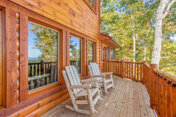 Log rocking chairs at Panorama, a 2 bedroom cabin rental located in Pigeon Forge