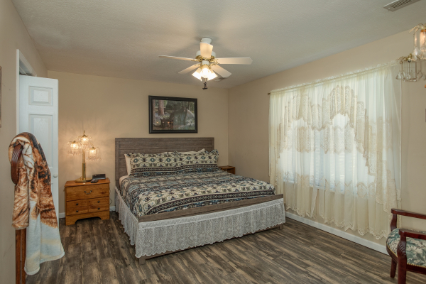 Bedroom with a king bed at Peace at the River, a 3 bedroom cabin rental located in Pigeon Forge
