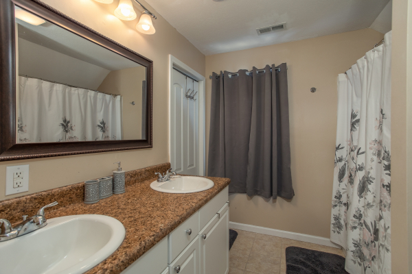 Bathroom with double sinks at Peace at the River, a 3 bedroom cabin rental located in Pigeon Forge