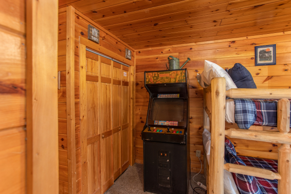 Arcade game in the game room at Hibernation Station, a 3-bedroom cabin rental located in Pigeon Forge