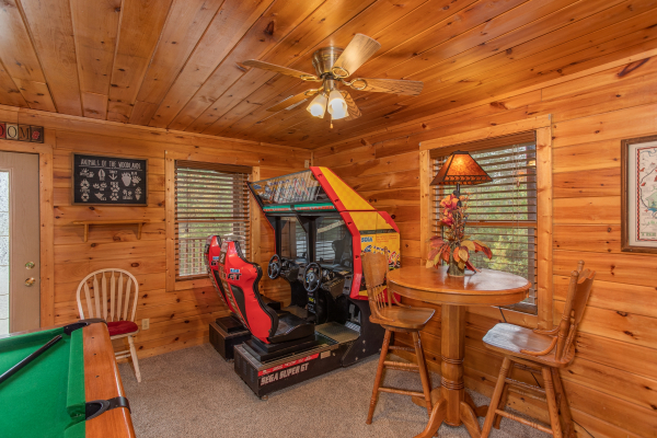 Car racing game in the game room at Hibernation Station, a 3-bedroom cabin rental located in Pigeon Forge