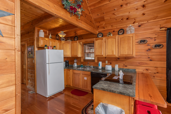 Fully equipped kitchen at Hibernation Station, a 3-bedroom cabin rental located in Pigeon Forge