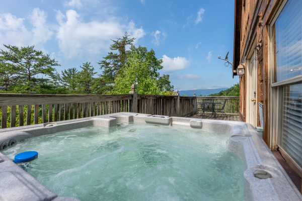 Hot tub with mountain view at American Beauty, a 2 bedroom cabin rental located in Pigeon Forge