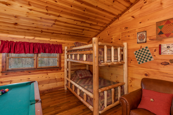 Bunk beds in the loft at Moonshiner's Ridge, a 1-bedroom cabin rental located in Pigeon Forge