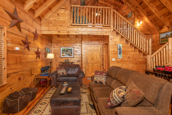Living room with sofa, chair, and two bean bag chairs at Granny D's, a 2 bedroom cabin rental located in Pigeon Forge