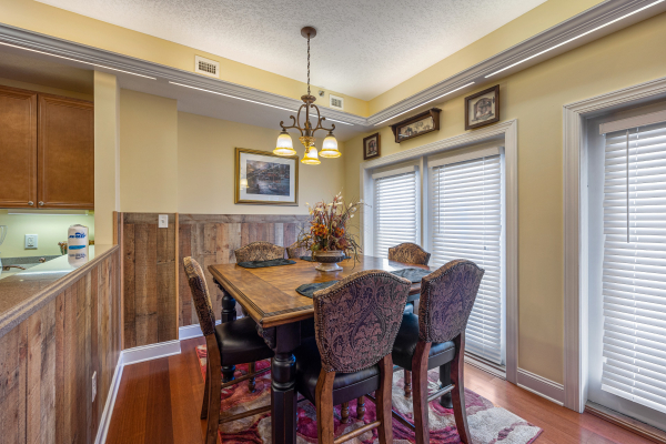Dining table for six at Heart of Gatlinburg, a 2 bedroom cabin rental located in Gatlinburg