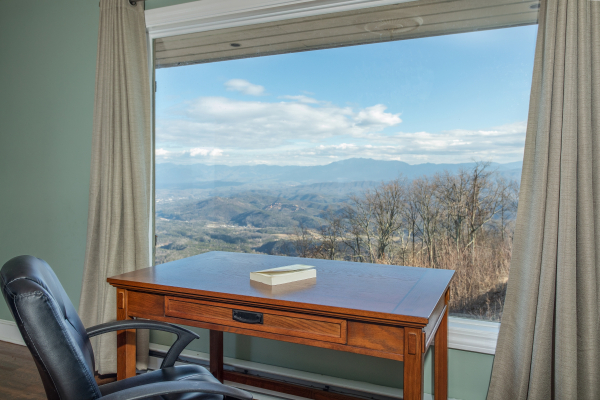 Writing desk in front of a window with mountain views at Best View Ever! A 5 bedroom cabin rental in Pigeon Forge