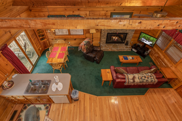 Looking down onto the main floor at Sweet Mountain Escape, a 2 bedroom cabin rental located in Pigeon Forge