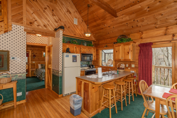 Kitchen with breakfast bar at Sweet Mountain Escape, a 2 bedroom cabin rental located in Pigeon Forge