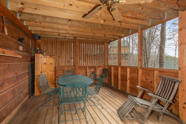 Porch with dining set for four at Sweet Mountain Escape, a 2 bedroom cabin rental located in Pigeon Forge