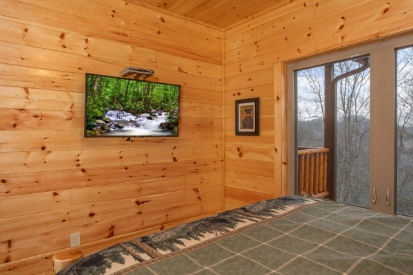 Wall mounted TV at Happy Bear's Hideaway, a 2 bedroom cabin rental located in Gatlinburg