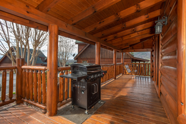 Grill on a covered deck at Better View, a 4 bedroom cabin rental located in Pigeon Forge